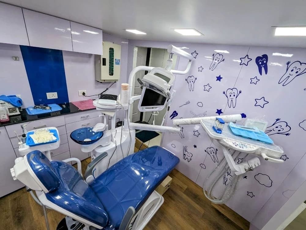 A dental chair and instrument tray in the treatment room